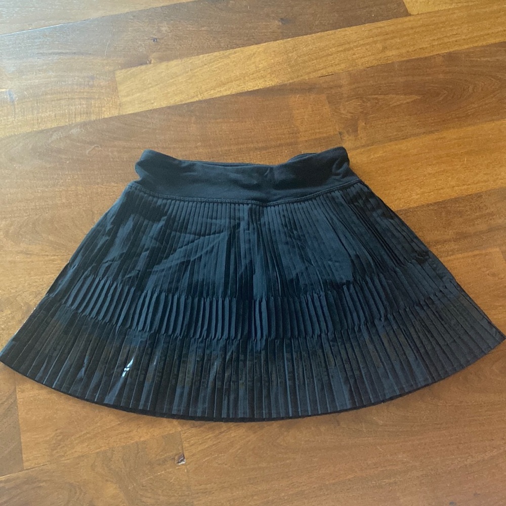 black pleated Ivivva tennis skort for girls